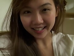 Sweet Asian Teen with Toys at Home